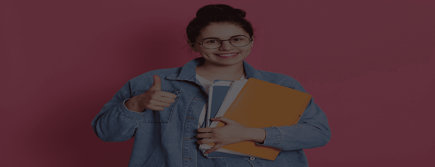 student holding a book